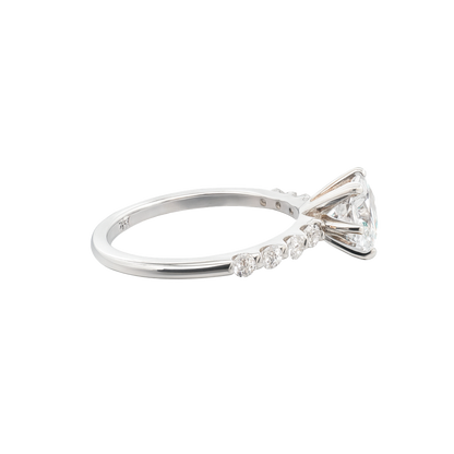 Diamond ring with a bow design on a white background