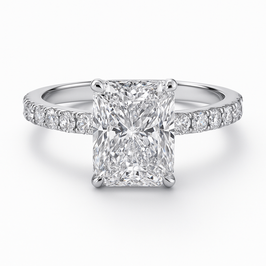 Diamond ring with a emerald-cut center stone on a white background