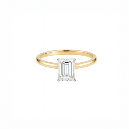 Gold ring with a diamond on a white background