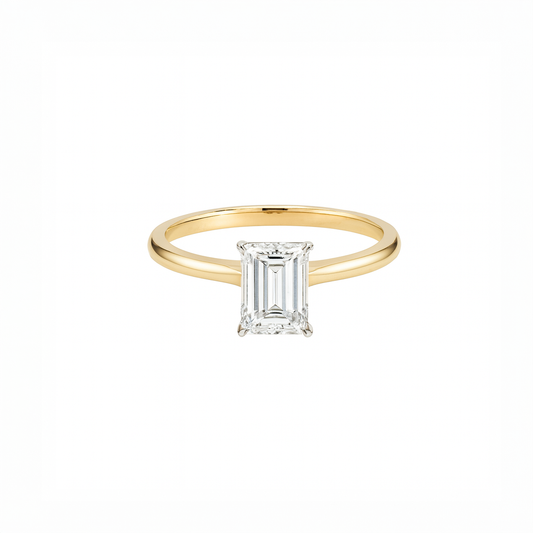 Gold ring with a diamond on a white background