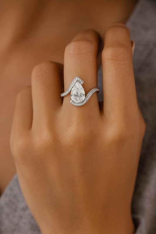 pear lab diamond ring in finger
