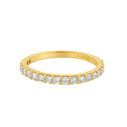 Gold band ring with diamonds on a white background