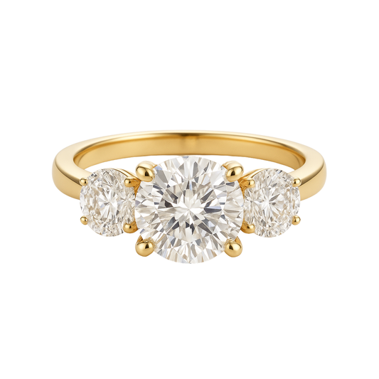 Gold ring with three diamonds on a white background