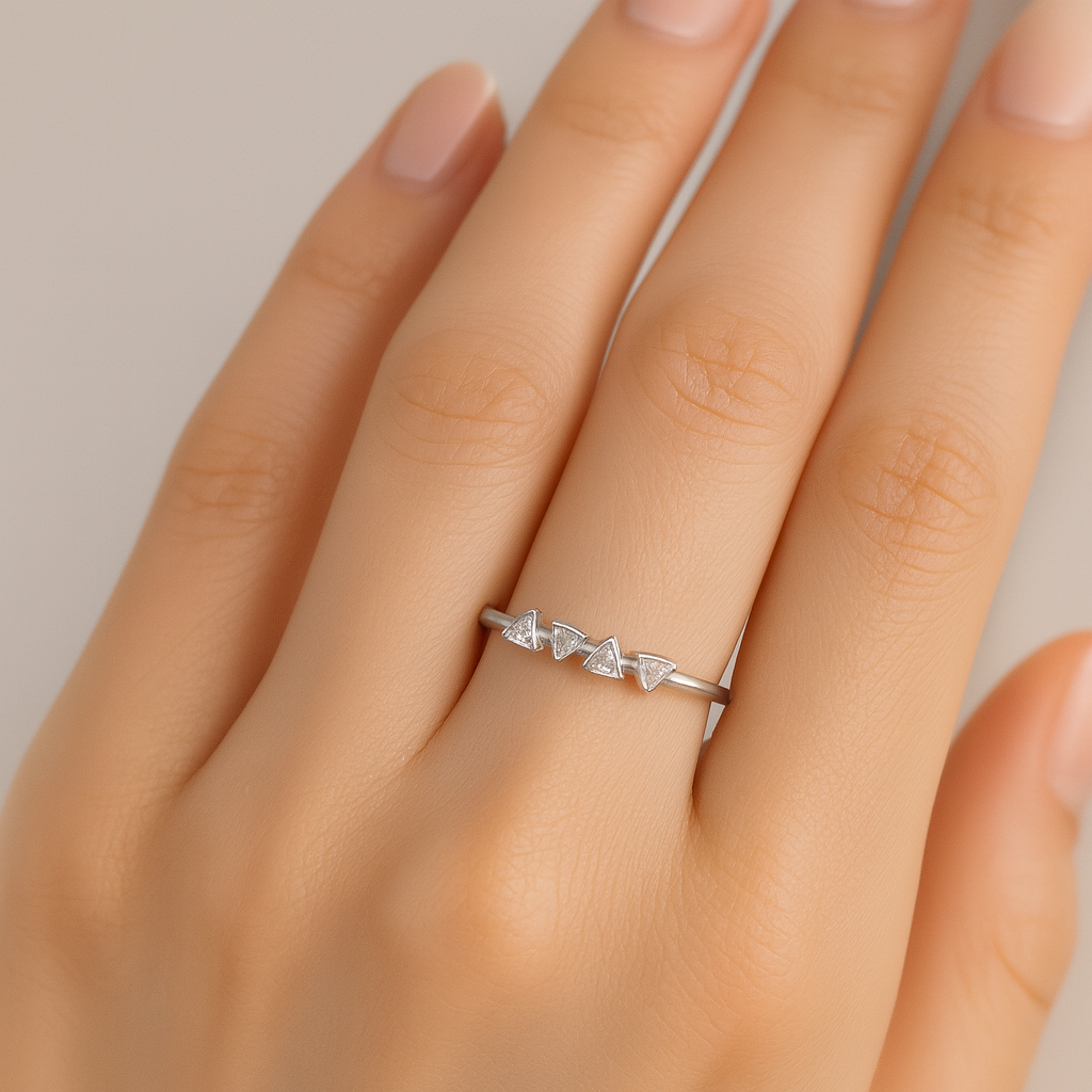riangle-shaped ring in hand